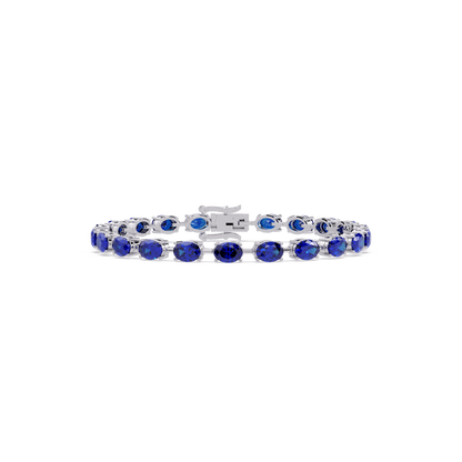 Oval-cut sapphire blue colorstone tennis bracelet in white gold