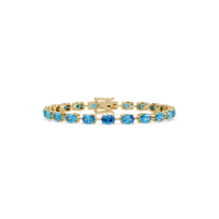 Oval-cut aquamarine blue colorstone tennis bracelet in yellow gold