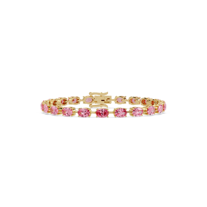 Oval-cut tourmaline pink colorstone tennis bracelet in yellow gold