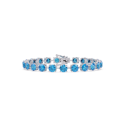 Round aquamarine blue colorstone tennis bracelet in white gold