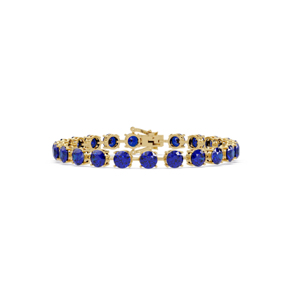 Round sapphire blue colorstone tennis bracelet in yellow gold