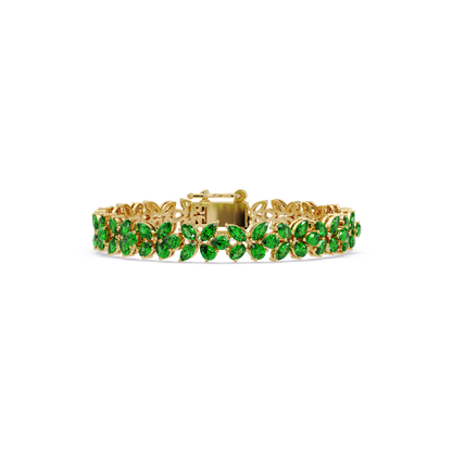 Mixed-shape emerald green colorstone tennis bracelet in yellow gold