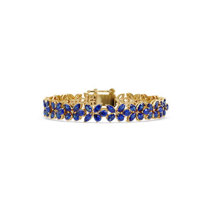 Mixed-shape sapphire blue colorstone tennis bracelet in yellow gold