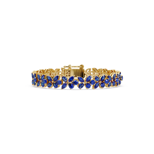 Mixed-shape sapphire blue colorstone tennis bracelet in yellow gold