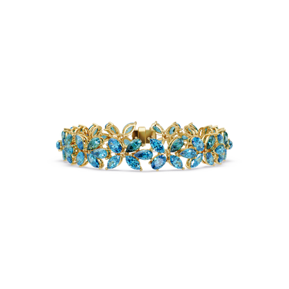Mixed-shape aquamarine blue colorstone tennis bracelet in yellow gold