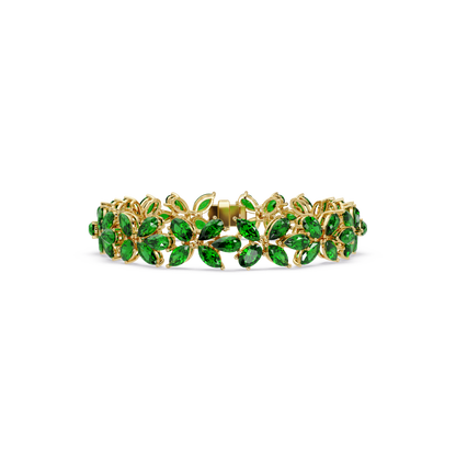 Mixed-shape emerald green colorstone tennis bracelet in yellow gold
