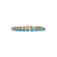 Mixed-shape aquamarine blue colorstone tennis bracelet in yellow gold