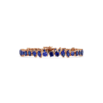 Oval, emerald, marquise, pear and round sapphire blue colorstone tennis bracelet in rose gold