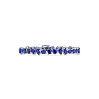 Oval, emerald, marquise, pear and round sapphire blue colorstone tennis bracelet in white gold