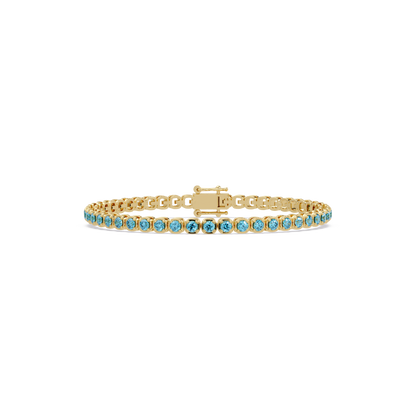 Round aquamarine blue colorstone tennis bracelet in yellow gold