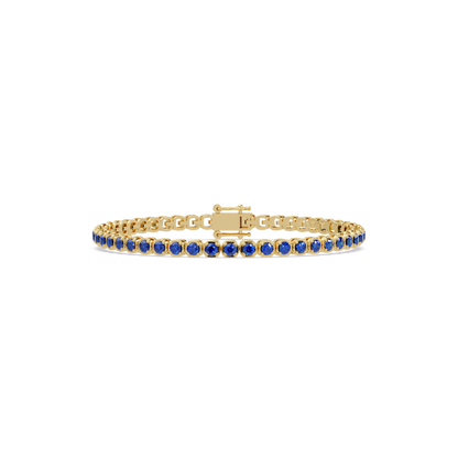 Round sapphire blue colorstone tennis bracelet in yellow gold