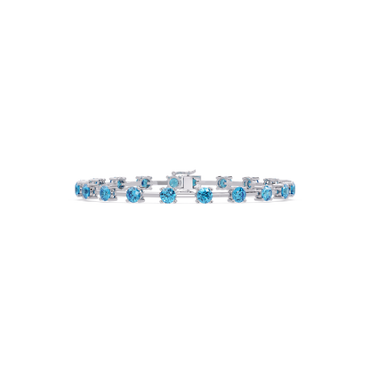 Round station aquamarine blue colorstone bracelet in white gold