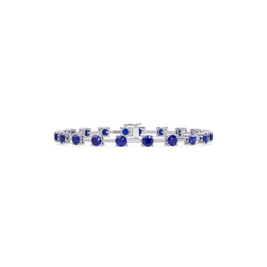 Round station sapphire blue colorstone bracelet in white gold