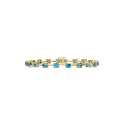Round station aquamarine blue colorstone bracelet in yellow gold