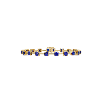 Round station sapphire blue colorstone bracelet in yellow gold