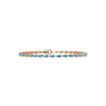 Pear-cut aquamarine blue colorstone tennis bracelet in rose gold