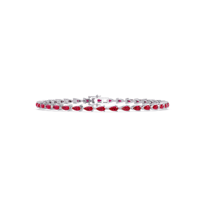 Pear-cut ruby red colorstone tennis bracelet in white gold