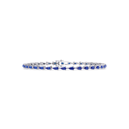 Pear-cut sapphire blue colorstone tennis bracelet in white gold