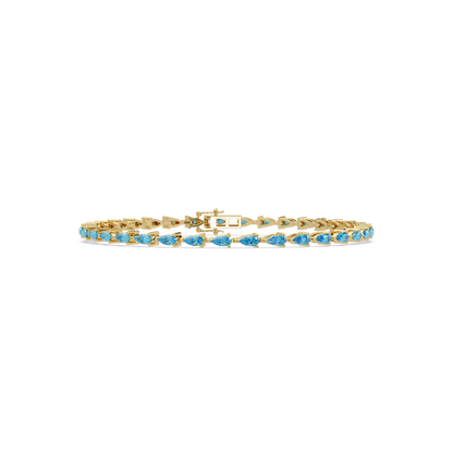 Pear-cut aquamarine blue colorstone tennis bracelet in yellow gold
