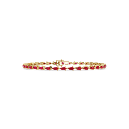 Pear-cut ruby red colorstone tennis bracelet in yellow gold