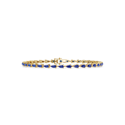 Pear-cut sapphire blue colorstone tennis bracelet in yellow gold