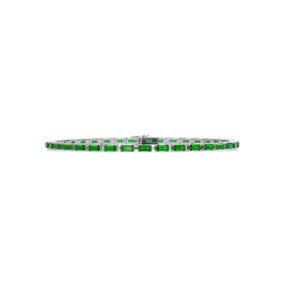 Emerald-cut emerald green colorstone tennis bracelet in white gold