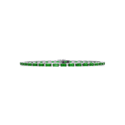 Emerald-cut emerald green colorstone tennis bracelet in white gold