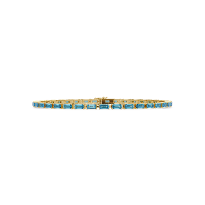 Emerald-cut aquamarine blue colorstone tennis bracelet in yellow gold