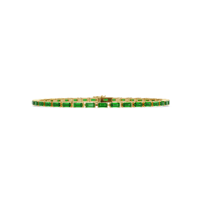 Emerald-cut emerald green colorstone tennis bracelet in yellow gold