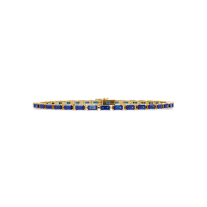 Emerald-cut sapphire blue colorstone tennis bracelet in yellow gold