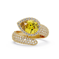 3.0 CTW pear-cut Citrine Yellow halo pavé bypass ring in 14K Yellow Gold with round pavé accent stones.