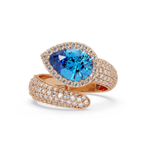 3.0 CTW pear-cut Aquamarine Blue halo pavé bypass ring in 14K Rose Gold with round pavé accent stones.