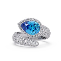 3.0 CTW pear-cut Aquamarine Blue halo pavé bypass ring in 14K White Gold with round pavé accent stones.