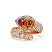 3.0 CTW pear-cut Champagne Topaz halo pavé bypass ring in 14K Rose Gold with round pavé accent stones.