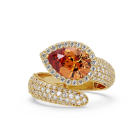 3.0 CTW pear-cut Champagne Topaz halo pavé bypass ring in 14K Yellow Gold with round pavé accent stones.