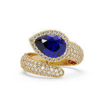 3.0 CTW pear-cut Sapphire Blue halo pavé bypass ring in 14K Yellow Gold with round pavé accent stones.