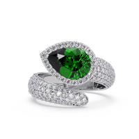 3.0 CTW pear-cut Emerald Green halo pavé bypass ring in 14K White Gold with round pavé accent stones.