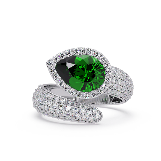 3.0 CTW pear-cut Emerald Green halo pavé bypass ring in 14K White Gold with round pavé accent stones.