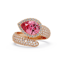 3.0 CTW pear-cut Tourmaline Pink halo pavé bypass ring in 14K Rose Gold with round pavé accent stones.