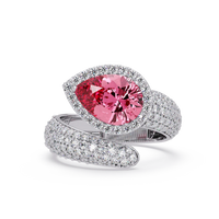 3.0 CTW pear-cut Tourmaline Pink halo pavé bypass ring in 14K White Gold with round pavé accent stones.