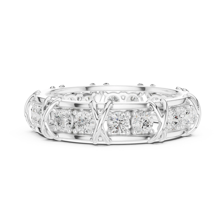 Close-up of a diamond band showing its sculpted prong setting and metal detail