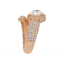 3.0 CTW pear-cut halo pavé bypass colorstone ring detail view with a pear center and round pavé accents.