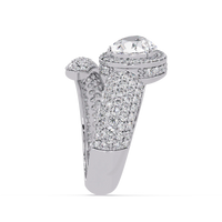 3.0 CTW pear-cut halo pavé bypass colorstone ring detail view with a pear center and round pavé accents.